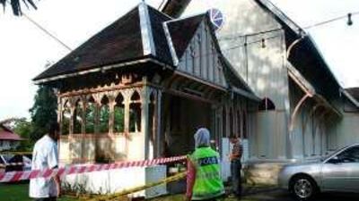 Police officers inspect damage at the All Saints Church in Taiping, Malaysia. A reader deplores the misunderstanding that resulted in the firebombing of churches after a court decision to allow Christians to use the word 'Allah' for God.