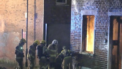 A house that was set on fire in the riots. PA