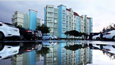 Waterlogged parking area in Discovery Gardens, Dubai after a night of rain. Pawan Singh / The National