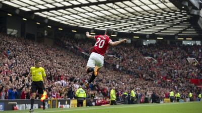Robin van Persie celebrates his goal against West Ham United on Saturday in Manchester United's 2-1 Premier League victory. Jon Super / AP / September 27, 2014