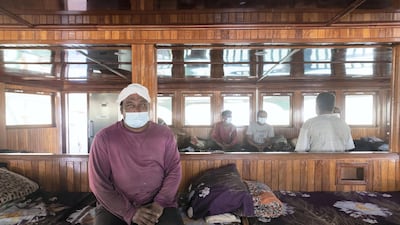 Sixten crew members live onboard the ship. Here some of them are in the dhow's accommodation. Antonie Robertson / The National