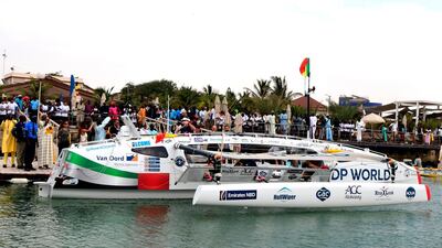 Local residents wait for the Row4ocean trimaran to leave Dakar to cross the Atlantic on December 14, 2018. AFP