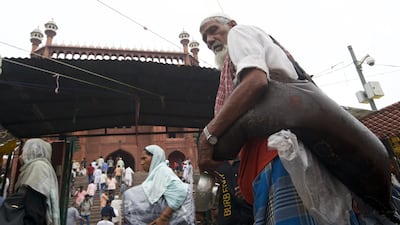Mr Umar offers free water to devotees on Fridays after prayers outside Jama Masjid in Delhi