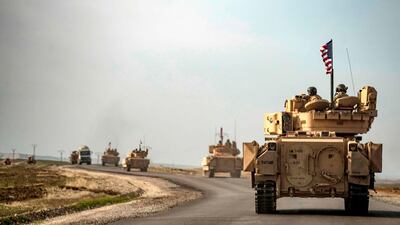 US soldiers in tanks patrol an area near Syria's north-eastern Semalka border crossing with Iraq's Kurdish autonomous territory. AFP