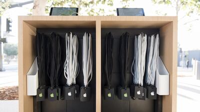 Badges hang in a kiosk ahead of the Apple event. Bloomberg