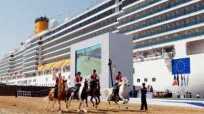 A horse show on the quayside in front of the Italian cruise ship Costa Deliziosa during it's naming ceremony at the official opening of the new Dubai Cruise terminal at Port Rashid.