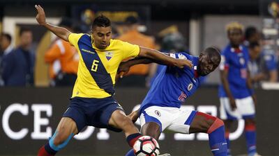 Ecuador’s Christian Noboa, left, and Haiti’s Jean Marc Alexandre vie for the ball. Eduardo Munoz Alvarez / AP Photo