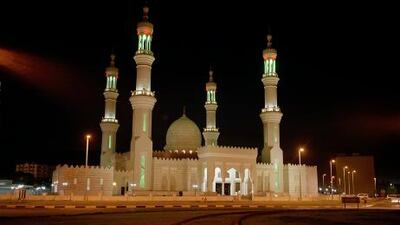 The exhibition My Father's House features Mosque At Night, part of the UAE: Vital Structures series from the late Tim Heatherington, above; below is a traditional mafraj, shot for a series by Yemeni photographer Boushra Al Mutawakel.