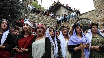 Iraqi Yazidi women gather outside the Temple of Lalish, in a valley near the Kurdish city of Dohuk about 430 kilometres northwest of the capital Baghdad, on April 16, 2019. AFP