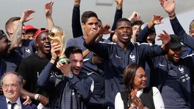 France players hold the World Cup trophy. Thomas Samson / AFP