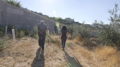 Vivien Sansour, one of the co-producers of The Golden Harvest, walking with farmer Abu Nidal, near the town in Walaji in the West Bank.