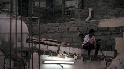 Firas, from Saudi Arabia, captures the story of a young man sitting in contemplation on the roof of his humble neighborhood at night and using a neon lamp as his only source of light. Courtesy National Geographic Abu Dhabi