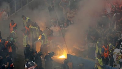 Stewards tend to a fire in the stands during the Euro 2016 Group F match between Iceland and Hungary in Marseille. Jean-Paul Pelissier / Reuters