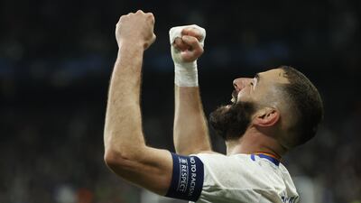 Real Madrid's Karim Benzema celebrates after scoring in the 3-1 comeback win over of PSG in the Champions League last-16 second leg on March 9, 2022. EPA