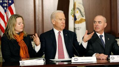 Joe Biden speaks at a White House event in 2015, when he was vice president. Alejandro Mayorkas, then deputy secretary of the Department of Homeland Security, now nominated to head the department, is pictured with him, along with Amy Pope, then senior director of the National Security Agency.