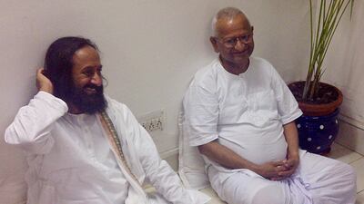Aug.17, 2011: Indian spiritual leader Sri Sri Ravi Shankar, left, calls on Anna Hazare inside the Tihar prison complex where Hazare is holding his hunger strike in New Delhi, India. AP Photo