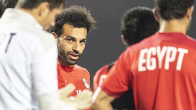 Egypt's forward Mohamed Salah listens to instructions. AFP
