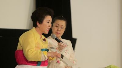Soon Ja Kim, president of the Kimchi Association of South Korea, demonstrates how to prepare cabbage kimchi at a Korean festival in Abu Dhabi at the National Theatre. Ravindranath K / The National