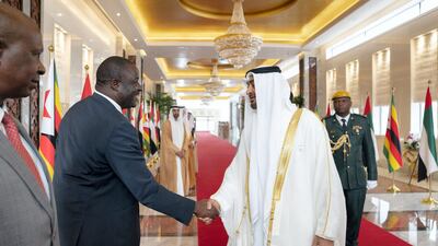 Sheikh Mohamed bin Zayed, Crown Prince of Abu Dhabi and Deputy Supreme Commander of the UAE Armed Forces, greets a member of the delegation accompanying Emmerson Mnangagwa, President of Zimbabwe, during a reception at the Presidential Airport in Abu Dhabi. Ryan Carter for the Ministry of Presidential Affairs