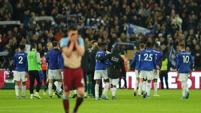 Leicester City players celebrate as Declan Rice of West Ham United looks dejected following the match at London Stadium. Getty Images