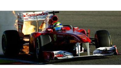 Flames leap from Felipe Massa's Ferrari yesterday. Paul Gilham / Getty Images