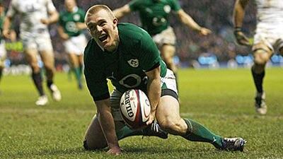 Wing Keith Earls celebrates scoring Ireland's second try against England in a match in which they outscored the hosts by three tries to one. The win puts Declan Kidney's side back on track to defend their Six Nations crown.