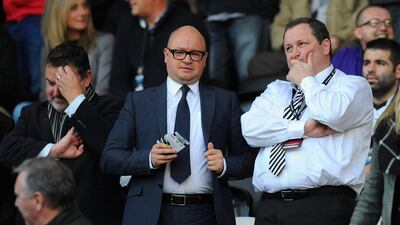 Lee Charnley, centre, alongside Newcastle United owner Mike Ashley during a 2014 Premier League game. Getty Images