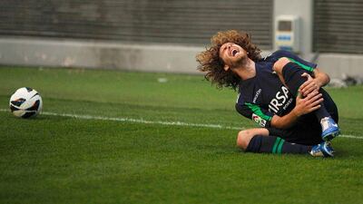 Jose Alberto Canas of Real Betis reacts in pain after being fouled during his Spanish First Division football match against Malaga. John Nazca / Reuters