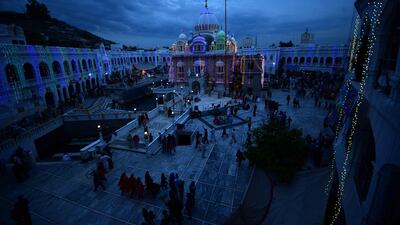 Twilight falls over the pilgrims at Gurdwara Punja Sahib, a Sikh temple, during the spring festival of Baisakhi, held in April. Mobeen Ansari