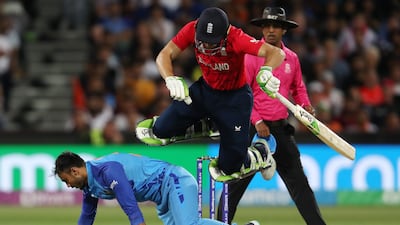 England captain Jos Buttler takes evasive action to avoid Axar Patel of India. Getty