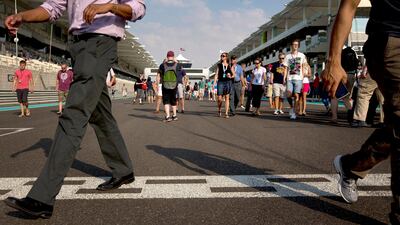 Fans take part in the pit walk day at Yas Marina Circuit. Christopher Pike / The National