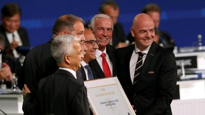 FIFA President Gianni Infantino (R) poses for a picture with officials after the announcement, that the 2026 FIFA World Cup will be held in the United States, Mexico and Canada, during the 68th FIFA Congress in Moscow, Russia June 13, 2018. Reuters / Sergei Karpukhin