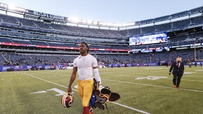 Washington quarterback Robert Griffin III walks off the field after his team's loss to the New York Giants in the NFL on Sunday. Julio Cortez / AP / December 14, 2014