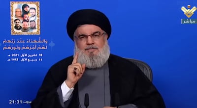 A handout grab made available from Hezbollah's al-Manar TV shows Hezbollah leader Sayyed Hassan Nasrallah giving a speech in Beirut, Lebanon, October 18, 2021. EPA