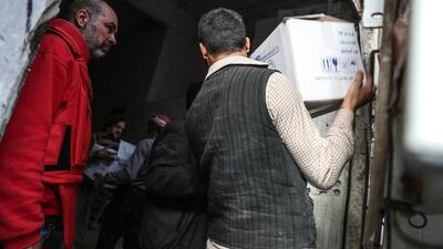 The UN has failed to ensure the safe entry into Eastern Ghouta of trucks loaded with humanitarian supplies and standing a short distance from the people who desperately need them. EPA