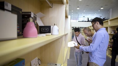 People look at products during the opening of OConnect in Dubai Investment Park. Christopher Pike / The National