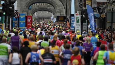 Runners cross Tower Bridge during the Virgin Money London Marathon on April 26, 2015 in London, England. (Photo by Alan Crowhurst/Getty Images)