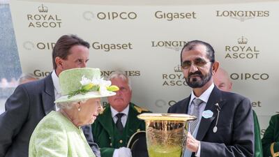 Vice President and Prime Minister of the UAE and Ruler of Dubai Sheikh Mohammed bin Rashid receives the winning trophy from Queen Elizabeth II. All photos by Wam