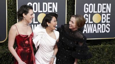 Phoebe Waller-Bridge, host Sandra Oh, and Jodie Comer, who collaborated on Killing Eve, pose together. EPA