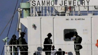South Korean naval special forces stand guard over Somali pirates after detaining them on the South Korean cargo ship Samho Jewelry in the Arabian Sea in January this year. In a daring raid, South Korean special forces stormed the hijacked freighter in the Arabian Se, rescuing all 21 crew members and killing eight assailants. South Korean navy via Yonhap/ AP Photo