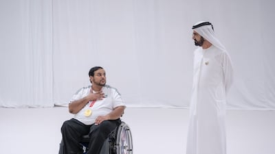 Sheikh Mohammed with Paralympic gold medallist Abdulla Al Aryani. The UAE won three medals in the Tokyo Games. Twitter