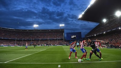 A general view as Karim Benzema of Real Madrid takes on Stefan Savic of Atletico Madrid. Laurence Griffiths / Getty Images