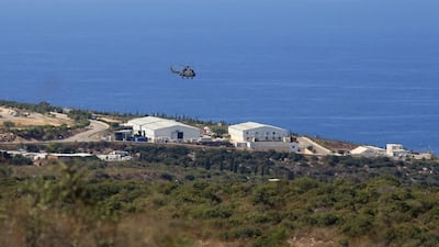 A helicopter flies over a UN base at the Lebanese border town of Naqoura, Lebanon, 28 October. US and UN brokered talks between Lebanese and Israeli delegations in Naqoura finished Thursday. AP Photo