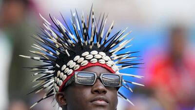 A fan sports some prickly headgear ahead of the Group G clash between Switzerland and Cameroon, at Al Janoub Stadium in Al Wakrah. AP Photo