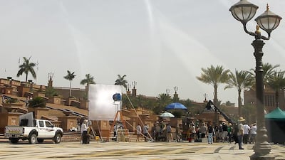 Sources reveal that a barge, set up with filming equipment and moored beside the twin buildings, is part of the F&F7 set. Jeffrey E Biteng / The National