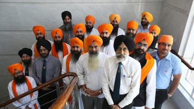 There are 35 permanent staff at the temple, as well as dozens of volunteers who give up their time to help. Standing at the front is TP Singh, one of the staff who keeps the temple running.