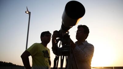 Dubai, UAE, June 23, 2013: Photography enthusiasts descernded upon the crescent of the Palm Jumeirah to photograph tonight's super moon. Seen here from left to right are Romit Shah and Canon Middle East's very own Irfan Khan. Lee Hoagland / The National *** Local Caption *** LH2306_MOON_FILE_005.JPG