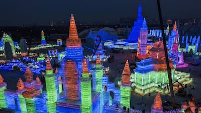 Chinese labourers work to finish large ice sculptures in preparation for the Harbin Ice and Snow Festival. Getty Images