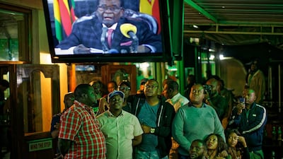 Zimbabweans watch a televised address to the nation by President Robert Mugabe at a bar in downtown Harare, Zimbabwe Sunday, Nov. 19, 2017. AP / Ben Curtis