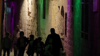 Palestinians walk in a market in the West Bank city of Nablus. EPA